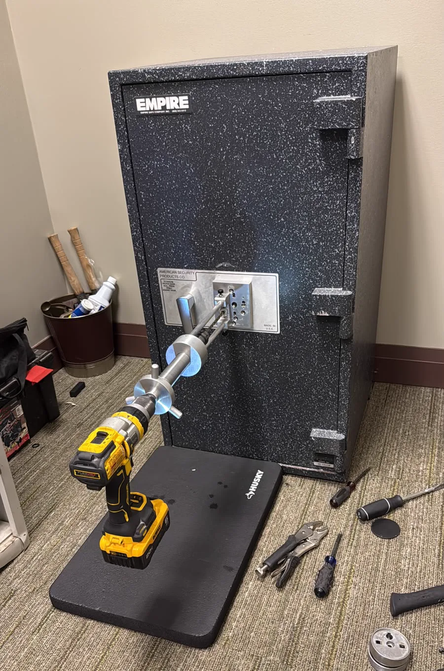 Locksmith opening a commercial safe inside a San Diego office
