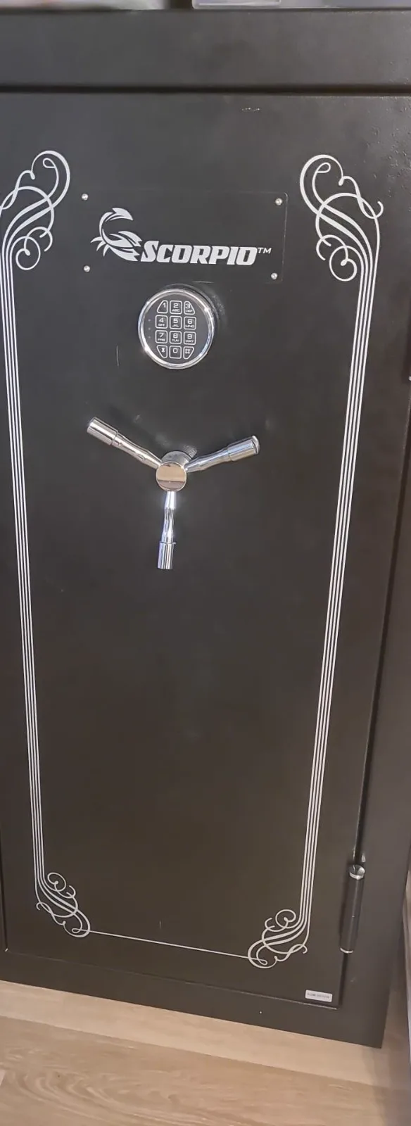 Tall gun safe being serviced in a San Diego garage