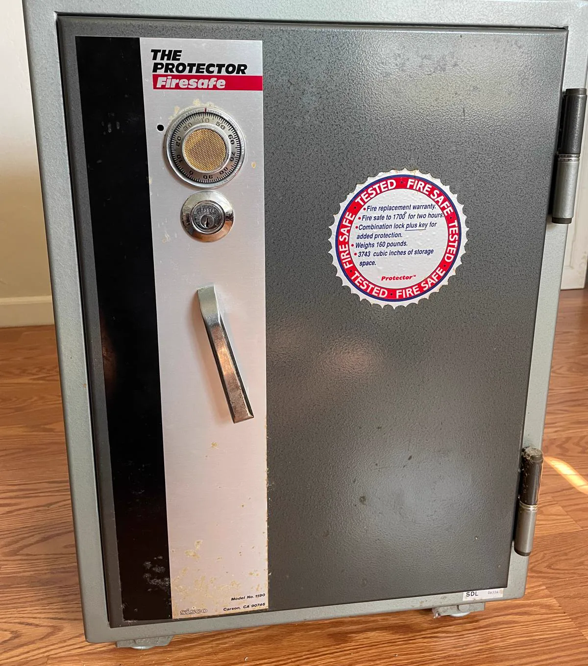 Protector fire safe with a combination dial and key lock in a home