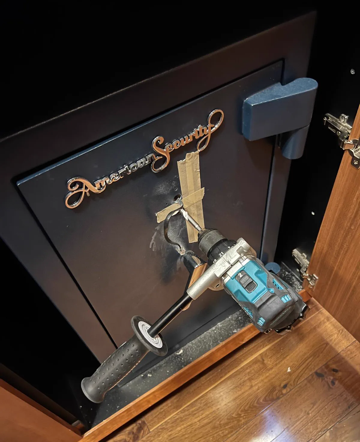Professional drill rig mounted on a home safe during a safe opening in San Diego